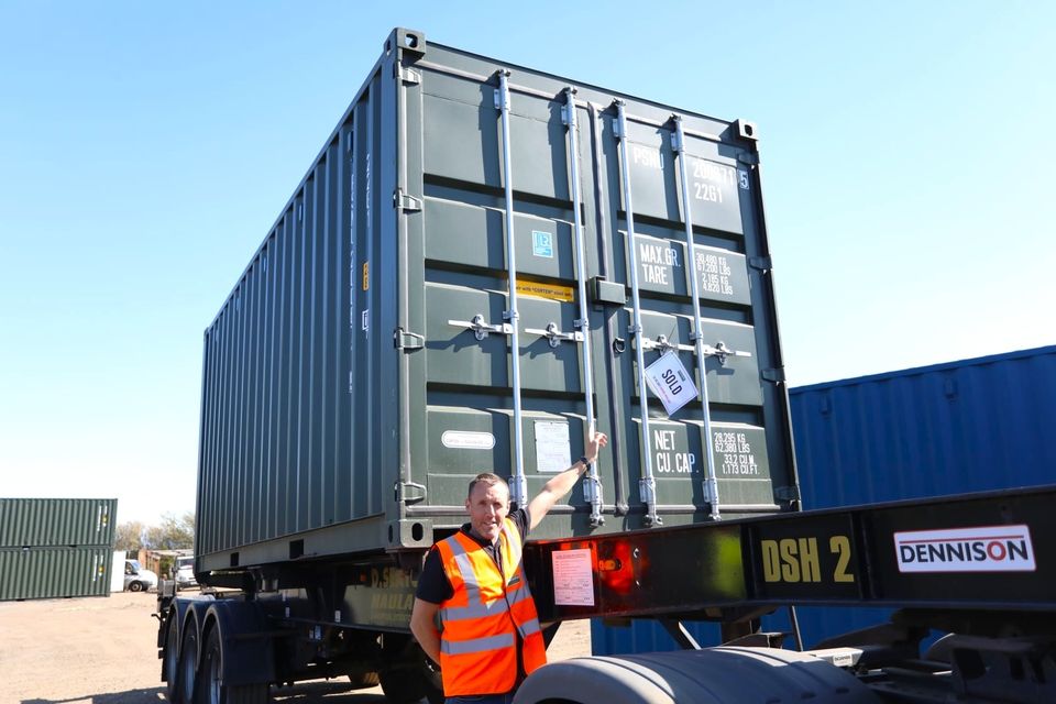 A sold sign on a container being collected